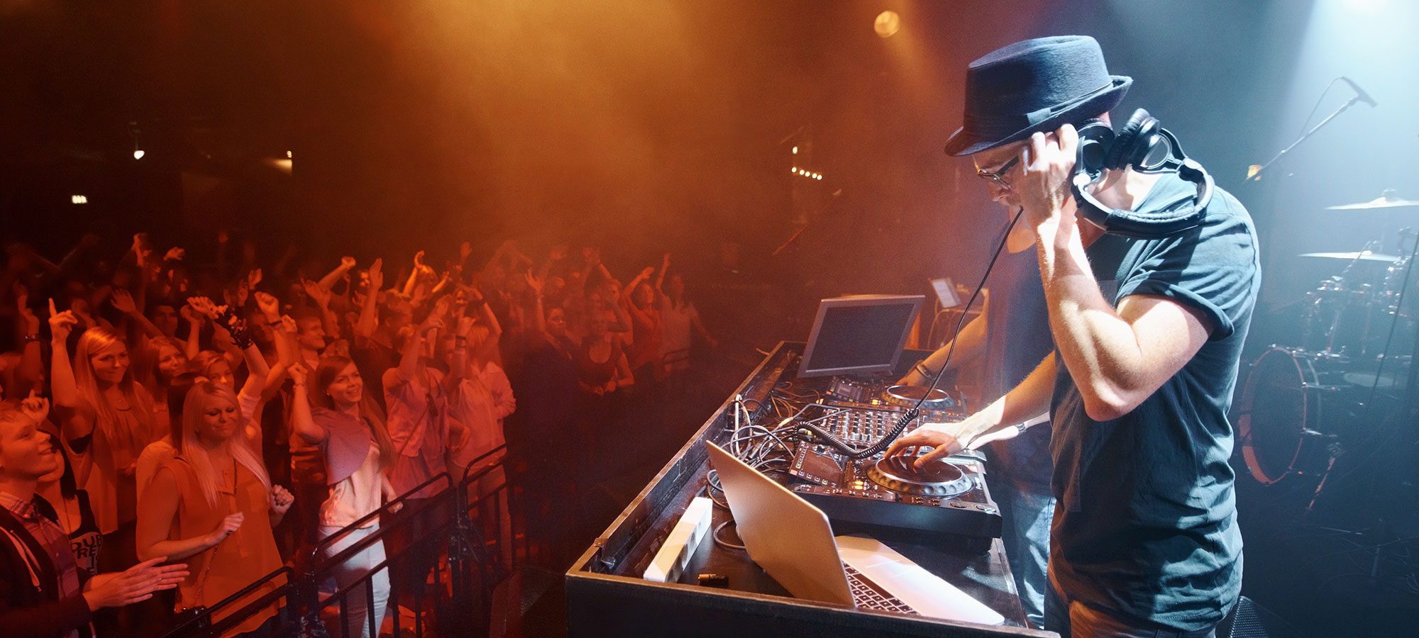 DJ spinning for a crowd of people