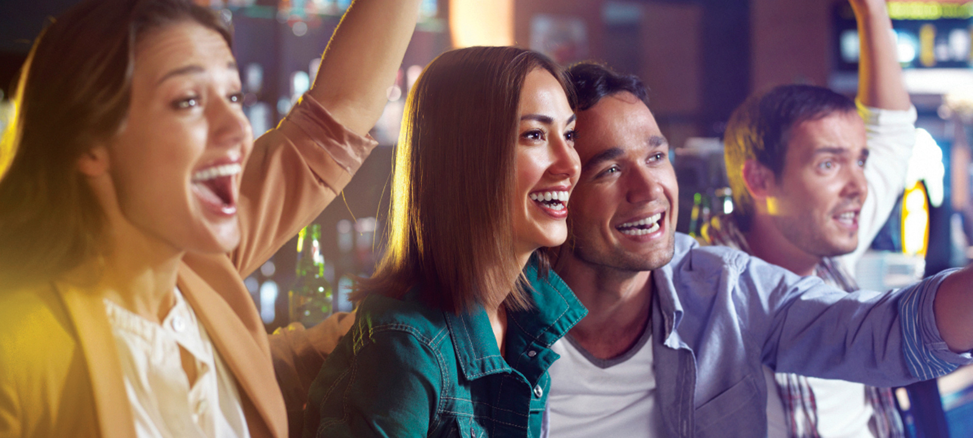 Fans cheering for their favorite team in the Sports Bar